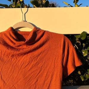 SelfLove orange, mock-turtleneck, bodysuit!! It’s ribbed and super soft.